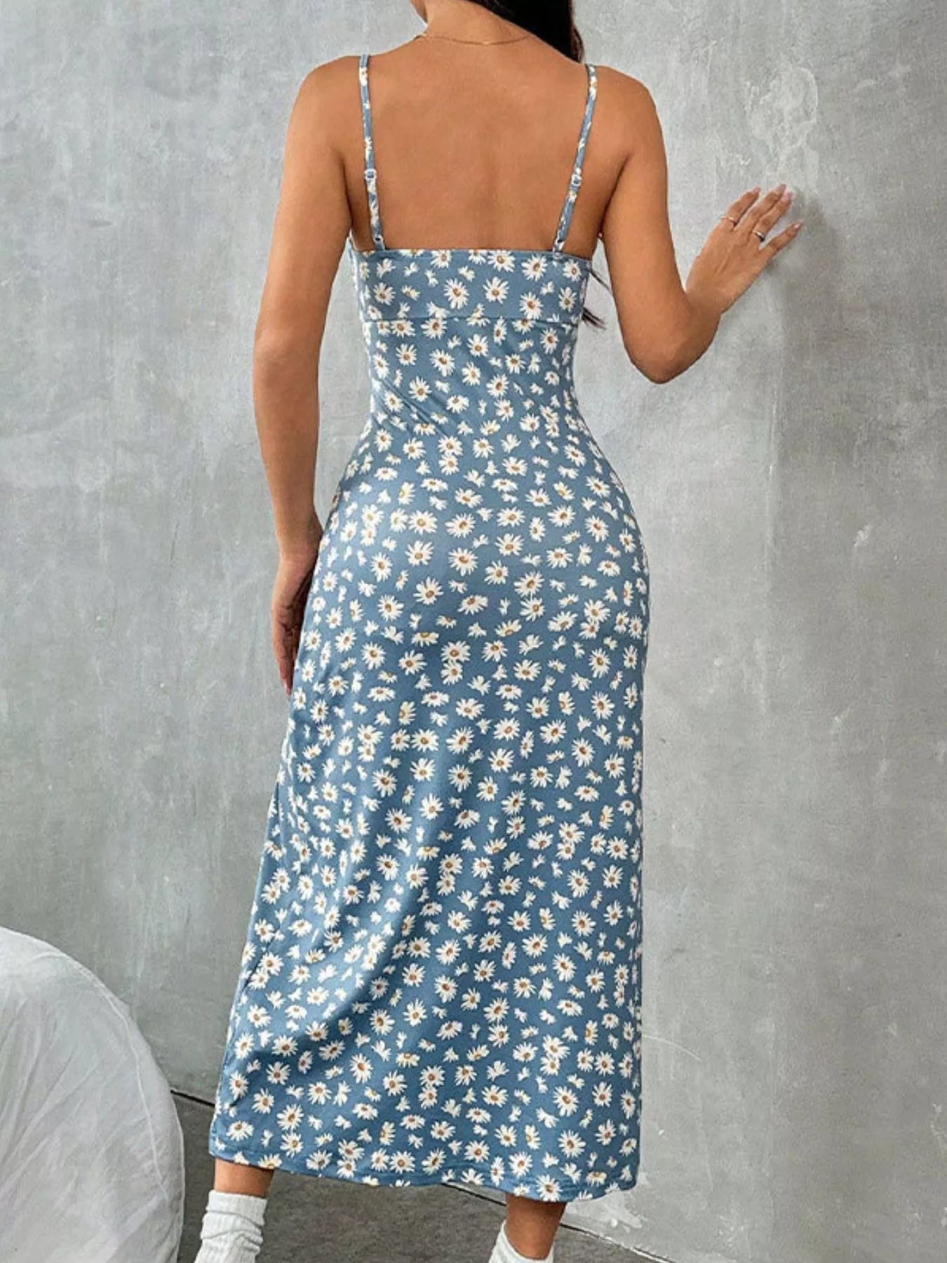 Full length view of the casual floral cami dress beautifully styled with white sneakers