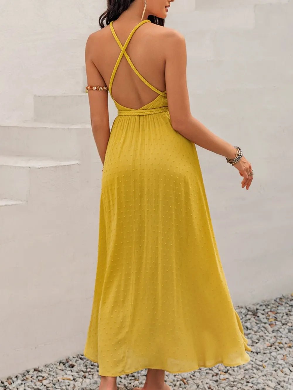 Back view of the backless halter dress showing the elegant tie design for summer parties