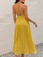 Back view of the backless halter dress showing the elegant tie design for summer parties